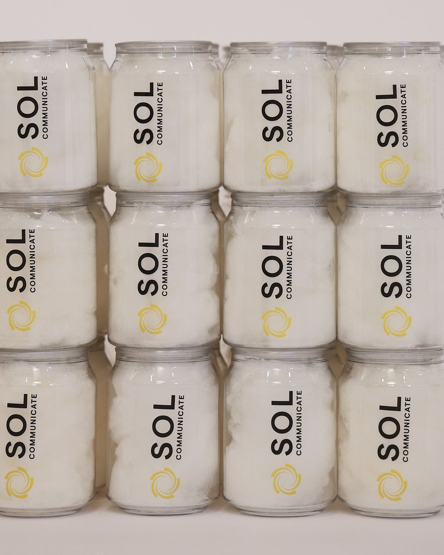 Stack of branded fairy floss cans with business logo