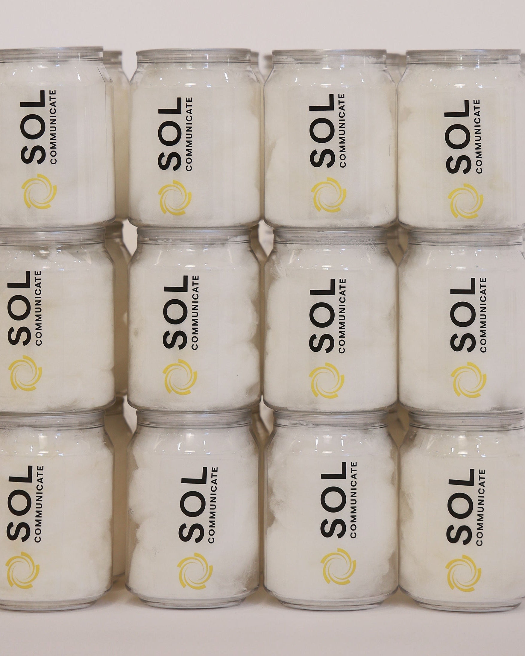 Stack of branded fairy floss cans with business logo