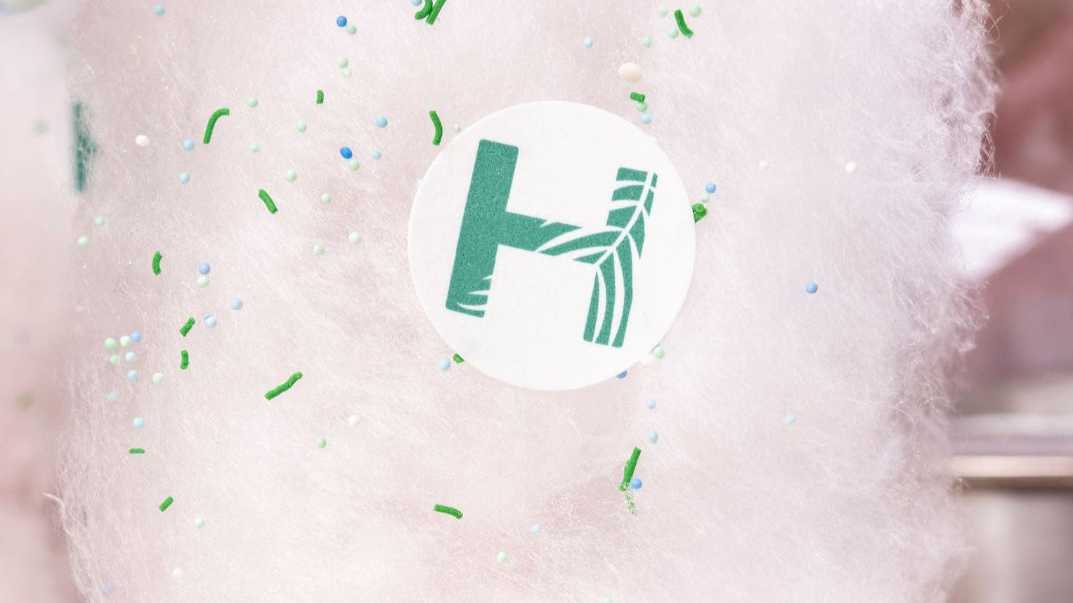 freshly spun fairy floss with sprinkles and corporate branding for event