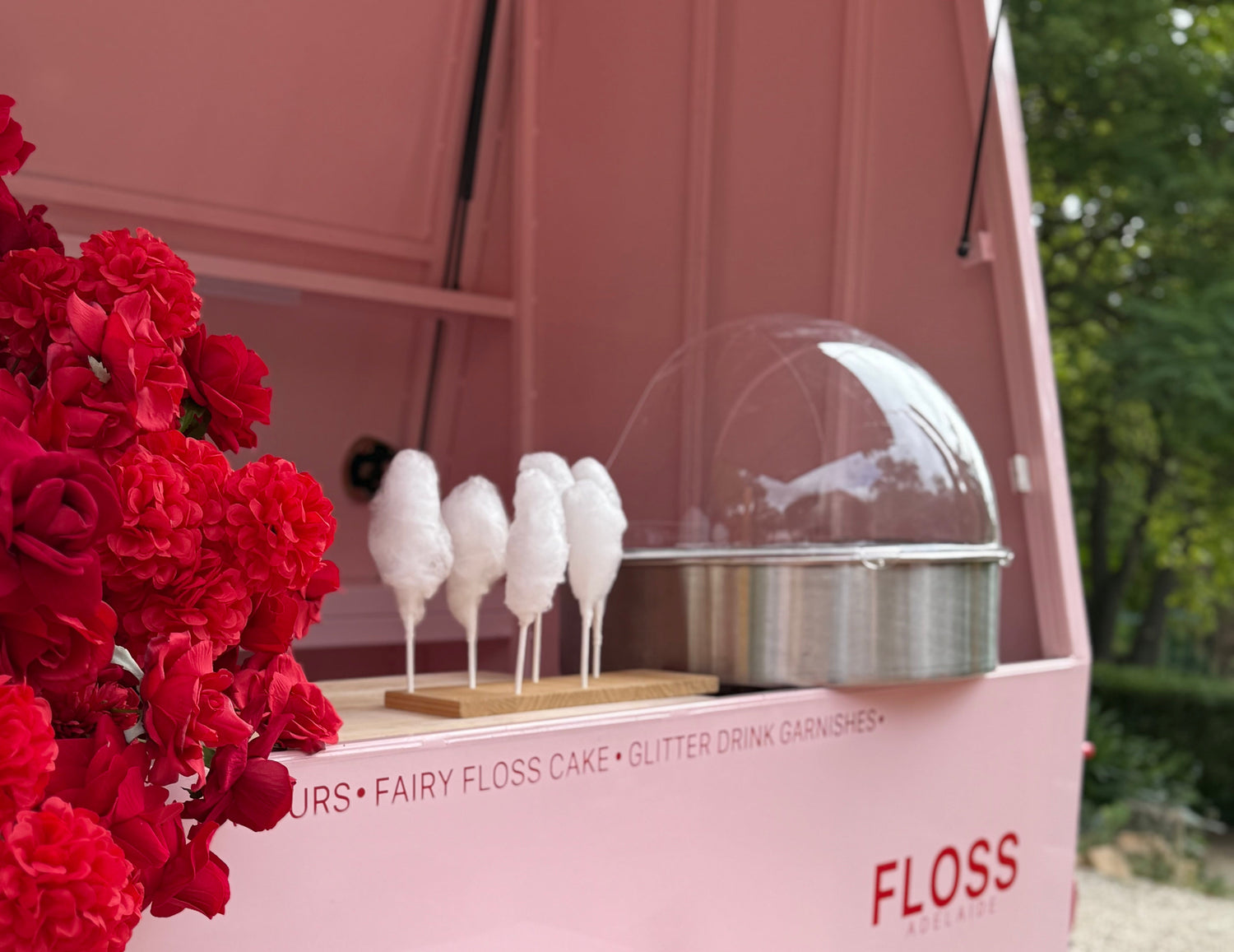 Floss Adelaide live spinning trailer and machine hire serving fairy floss at outdoor event 